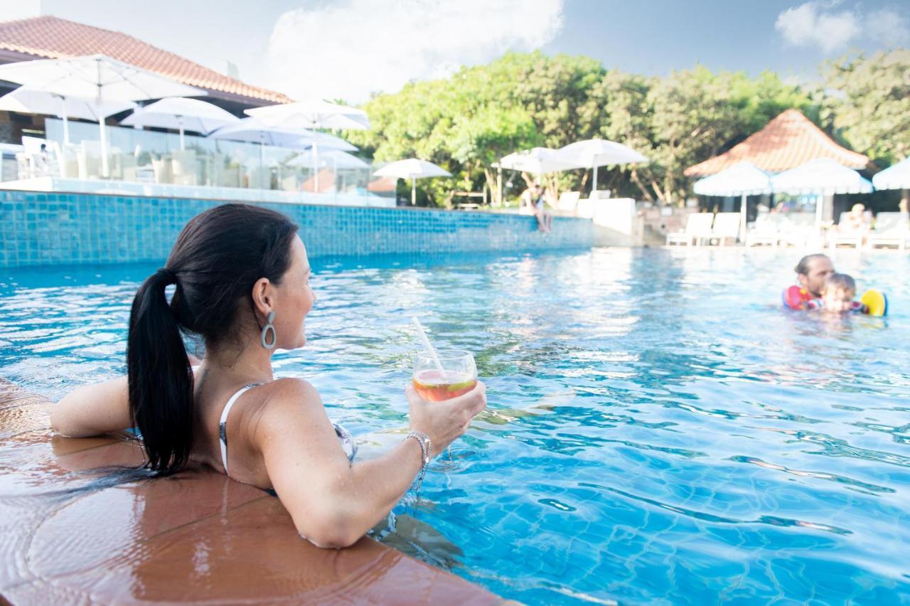 Hotel The Capital Zimbali à Ballito Extérieur photo A woman relaxing at a pool